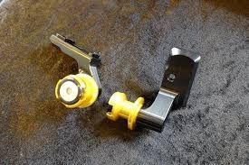 CHAIN ADJUSTER CAPS WITH SWING ARM SPOOLS